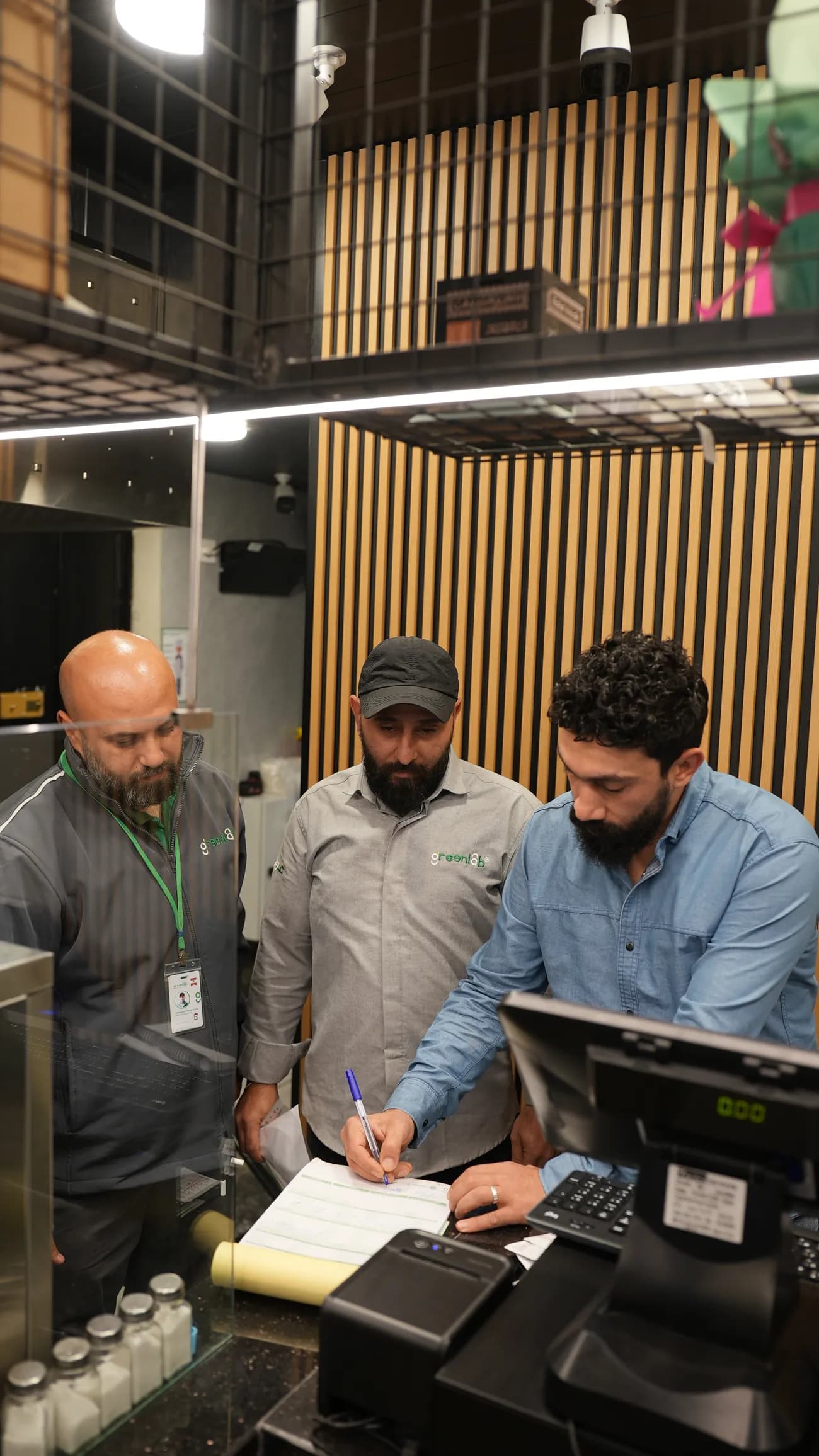 GreenLab team members reviewing a service plan onsite.